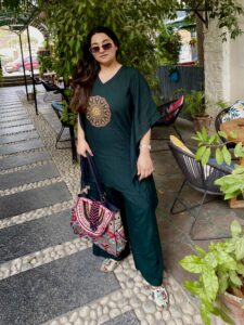 Woman wearing olive green mehendi kaftan trouser festive set