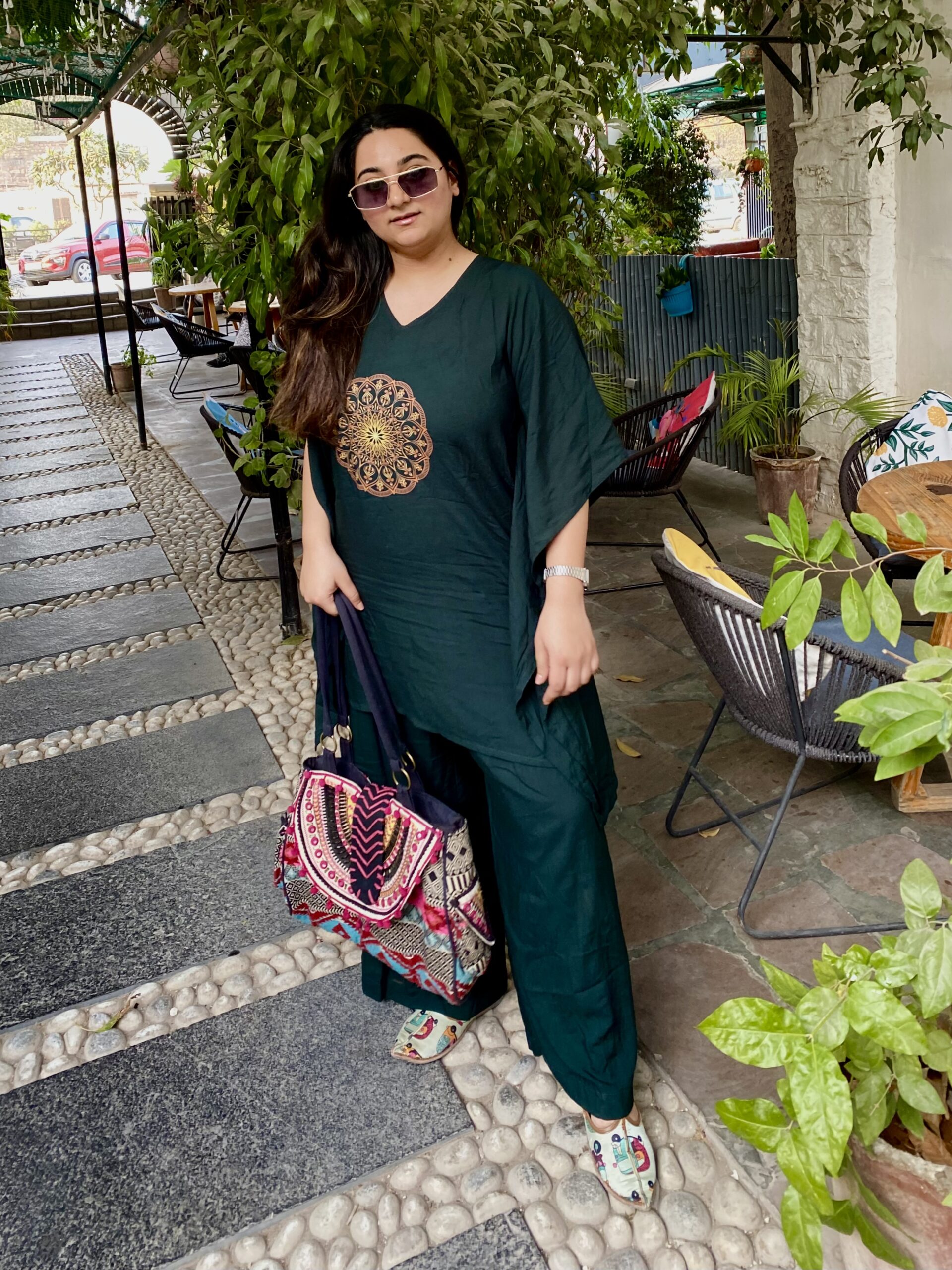 Woman wearing olive green mehendi kaftan trouser festive set